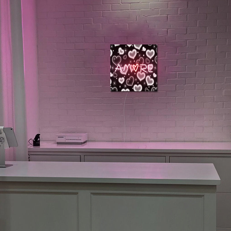 Neonový nápis Dell Amore na koleji